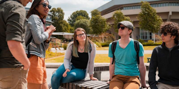 a group of PhD students with Central hall in the background